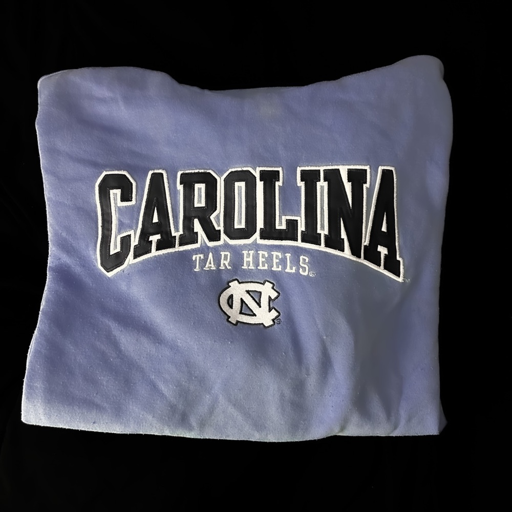 UNC champion hoodie. Light blue with embroidered lettering.